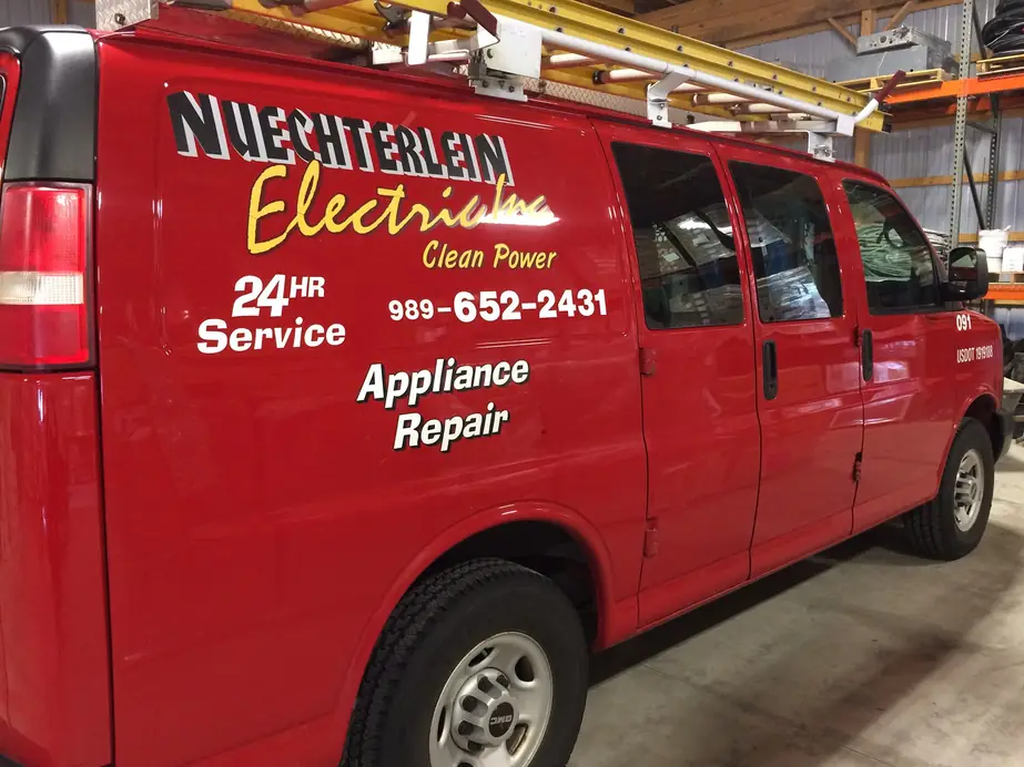 A Nuechterlein Electric service van lettered Clean Power, 24HR Service and Appliance Repair.